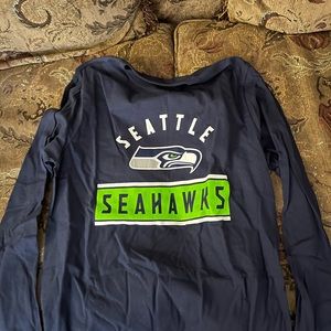Seattle Seahawks football jersey, pullover, two zip up jackets.